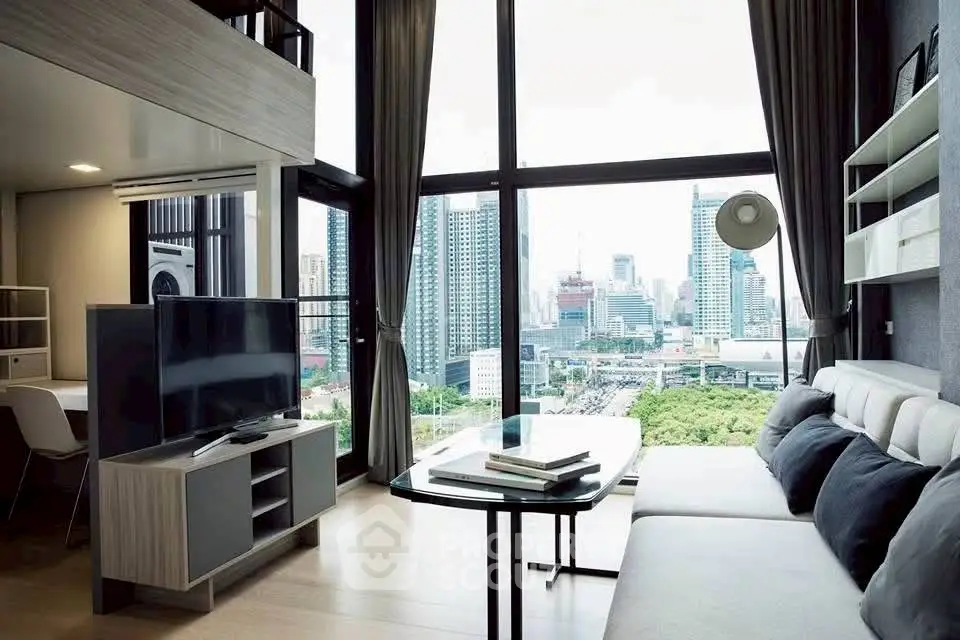 Modern living room with stunning city view and floor-to-ceiling windows