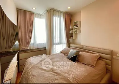 Cozy bedroom with elegant curtains and stylish decor in modern apartment
