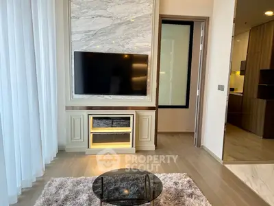 Modern living room with TV, marble accents, and cozy rug