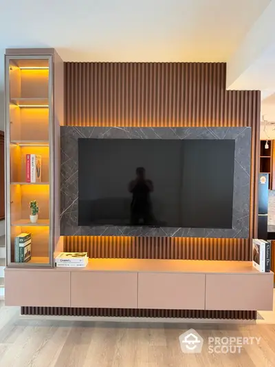 Modern living room with stylish TV wall unit and ambient lighting