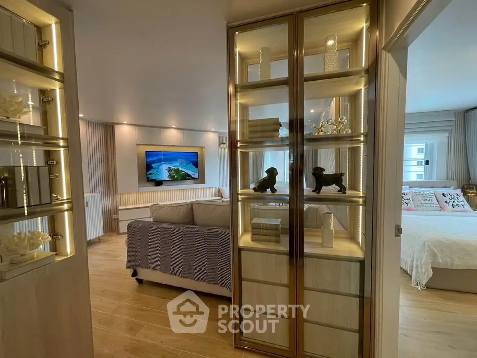 Luxurious living room with elegant decor and cozy bedroom view, perfect for modern living.