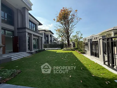 Luxurious modern home with spacious garden and elegant architecture