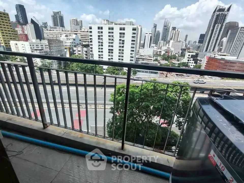 Stunning urban balcony view with city skyline and modern architecture.