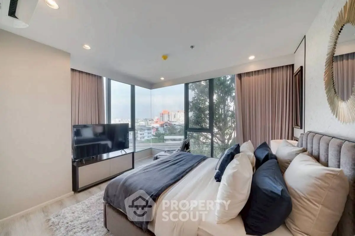 Luxurious bedroom with panoramic city view and modern decor