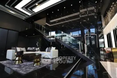 Luxurious modern living room with sleek black marble and elegant furnishings
