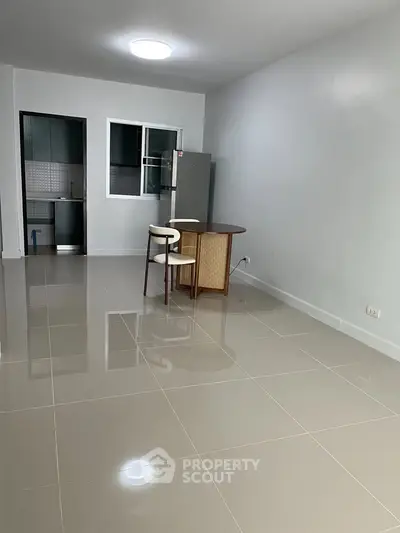 Spacious open-plan living area with modern kitchen and dining space