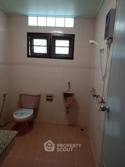 Spacious bathroom with modern fixtures and natural light