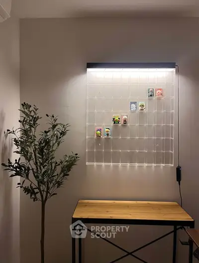 Stylish interior with modern wall display and wooden table, perfect for showcasing collectibles.