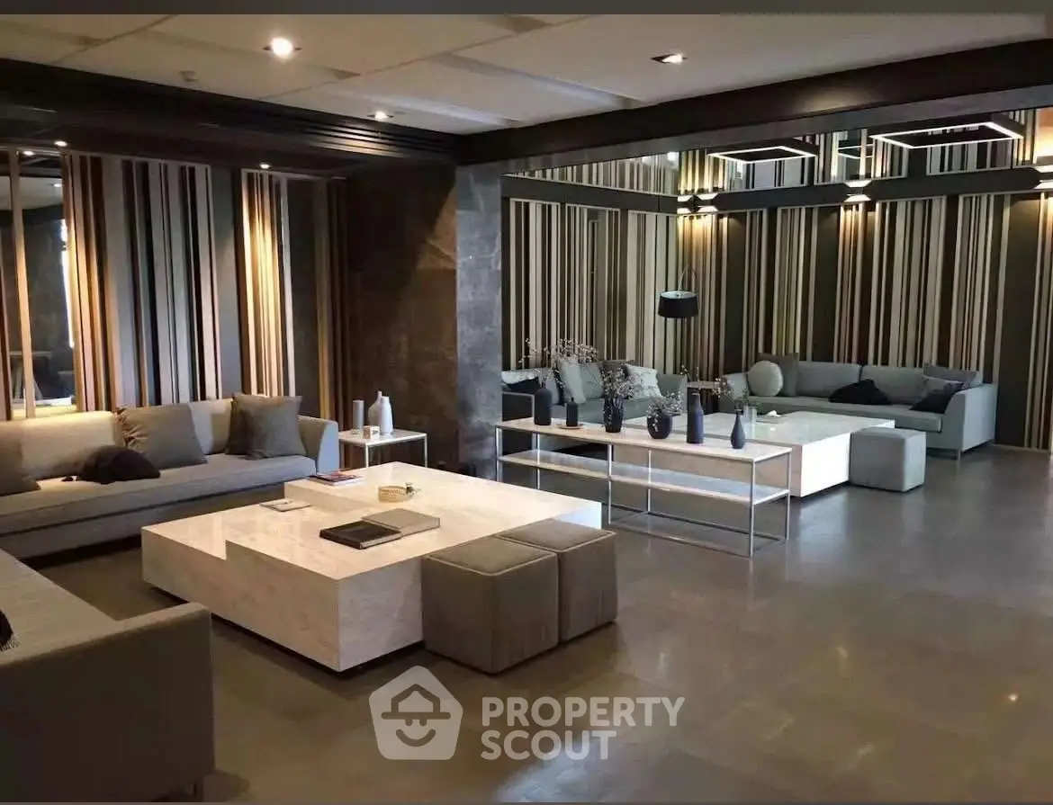 Luxurious modern living room with stylish decor and spacious seating area.