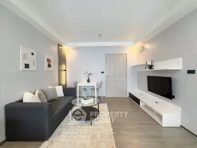 Modern living room with sleek furniture and stylish decor, perfect for urban living.