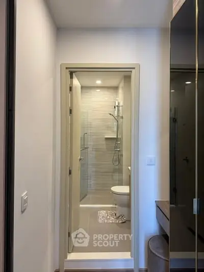 Modern compact bathroom with sleek shower and elegant design