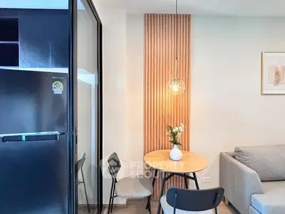 Modern living room with stylish decor and cozy seating area, perfect for relaxation.