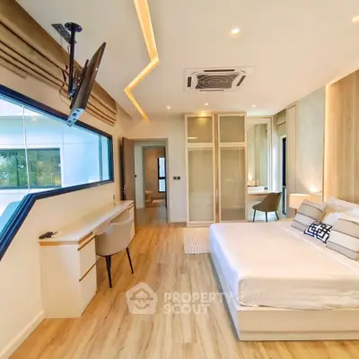 Luxurious modern bedroom with elegant decor and large window view