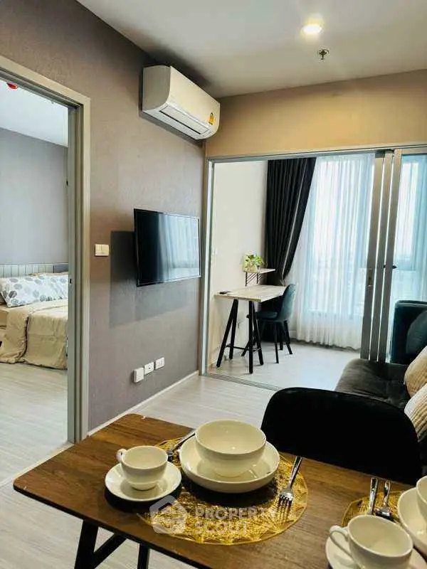 Modern apartment interior with cozy living room and dining area, featuring stylish decor and natural light.