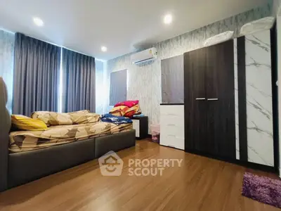 Modern bedroom with stylish decor and ample natural light