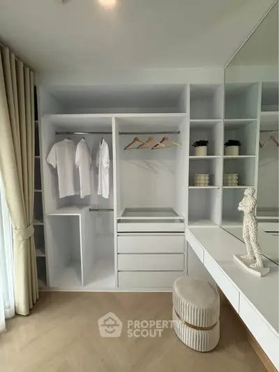Spacious walk-in closet with modern shelving and natural light
