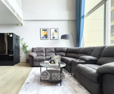 Spacious modern living room with large sectional sofa and stylish decor