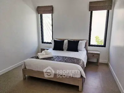 Cozy bedroom with modern decor and natural light