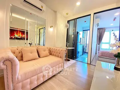 Luxurious living room with elegant sofa and modern decor in a stylish apartment.