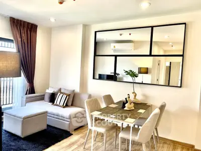 Modern living room with stylish decor and dining area in open layout apartment.