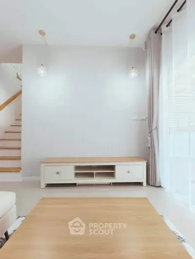 Modern living room with minimalist decor and natural light