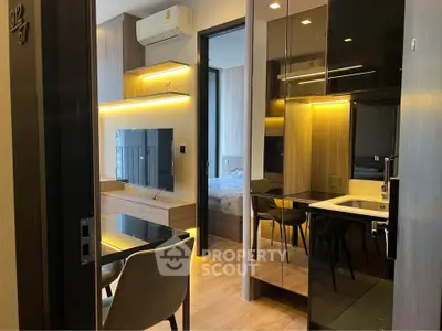 Modern apartment interior with sleek design and built-in furniture, featuring a cozy living area and stylish decor.