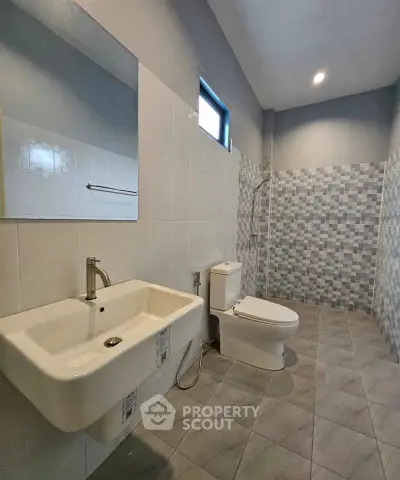 Modern bathroom with sleek fixtures and stylish tile design