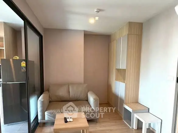 Modern living room with cozy sofa and sleek storage in a stylish apartment.