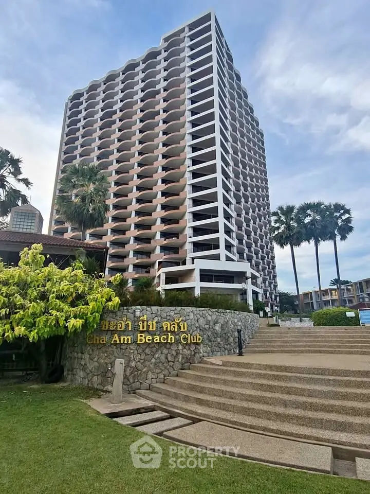 Stunning beachfront condominium with modern architecture and lush landscaping