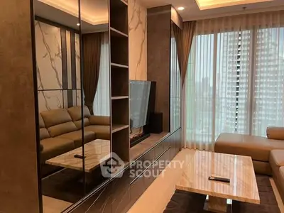 Luxurious modern living room with marble accents and city view, featuring elegant furniture and large windows.
