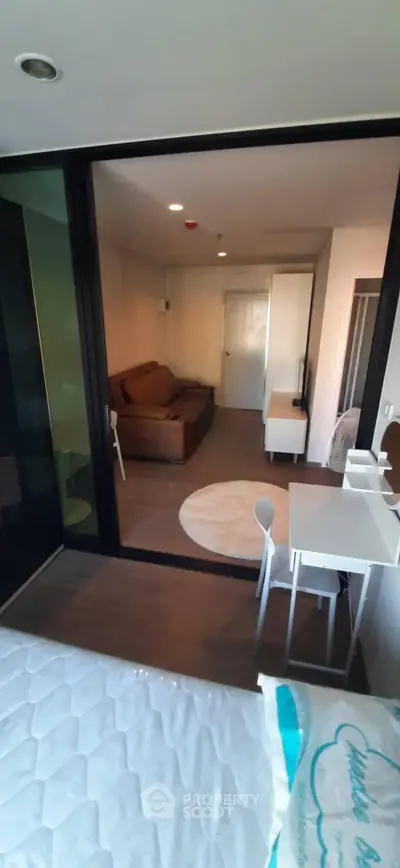 Modern studio apartment with cozy living area and stylish furniture