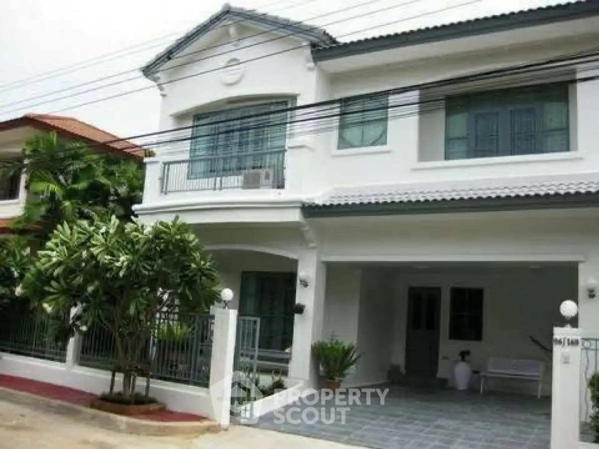 Charming two-story house with lush garden and spacious driveway
