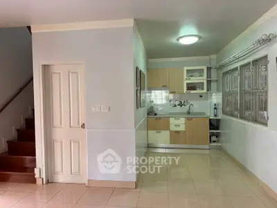 Modern kitchen with open layout and wooden cabinets in a bright home interior