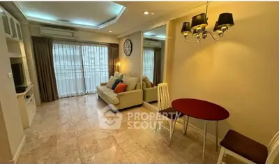 Charming living room with elegant lighting and cozy seating area, perfect for relaxation and entertainment.