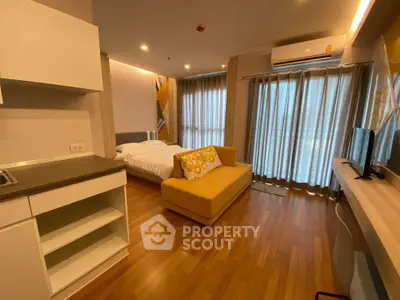 Modern studio apartment with cozy living area and natural light