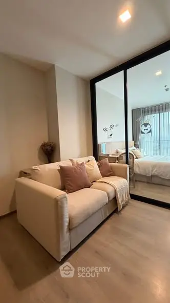 Cozy living room with modern decor and large window view