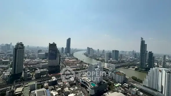 Stunning cityscape view with river and skyscrapers, perfect for urban living enthusiasts.