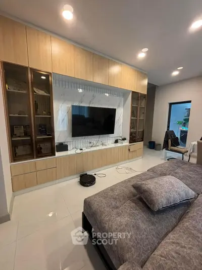 Modern living room with built-in entertainment center and sleek design