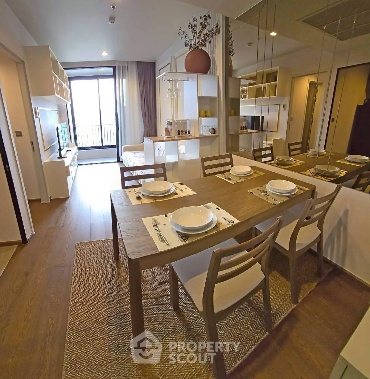 Modern open-plan living and dining area with stylish decor and natural light.