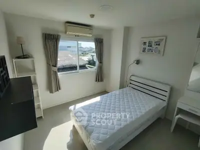 Bright and cozy bedroom with natural light and modern furnishings