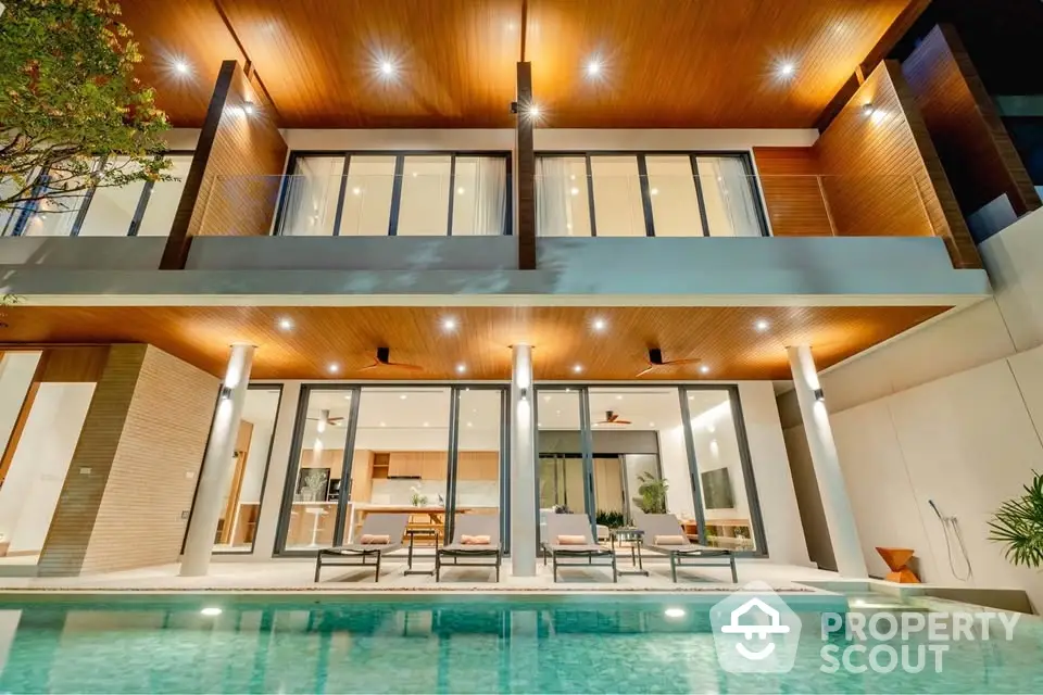 Luxurious modern villa with pool and elegant lighting, perfect for upscale living.