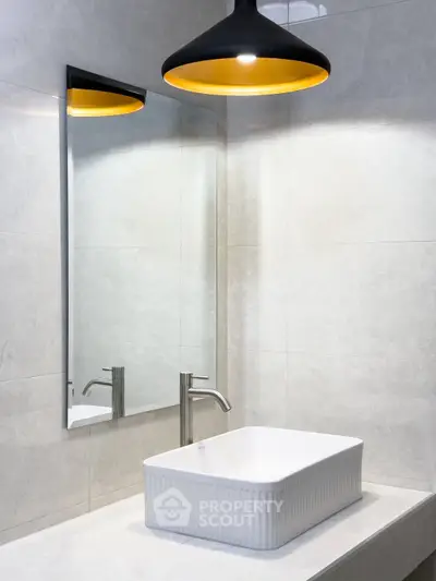 Modern bathroom with stylish sink and elegant lighting