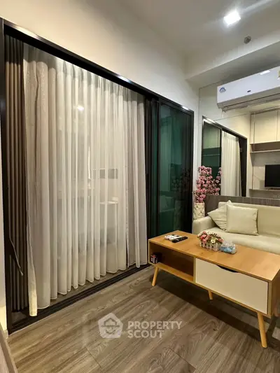 Modern living room with elegant curtains and cozy seating area