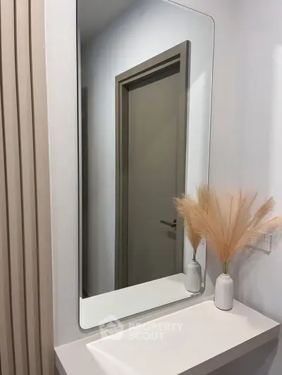 Modern bathroom with sleek mirror and minimalist decor