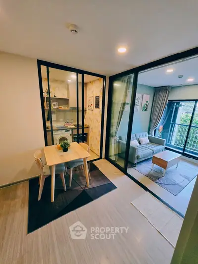 Modern apartment with open living room and dining area, featuring a cozy balcony view.