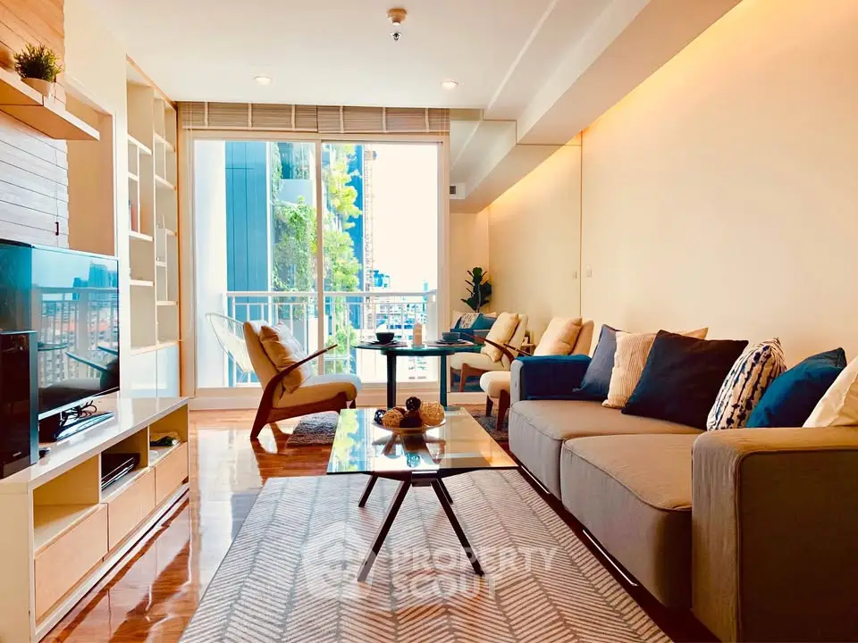 Spacious modern living room with stylish decor and balcony view