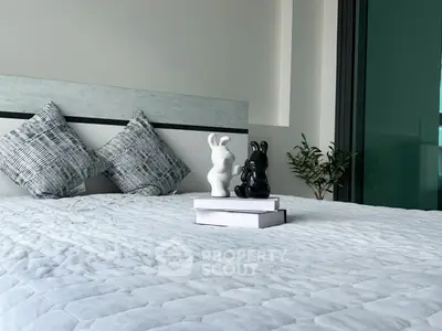 Modern bedroom with stylish decor and cozy bedding