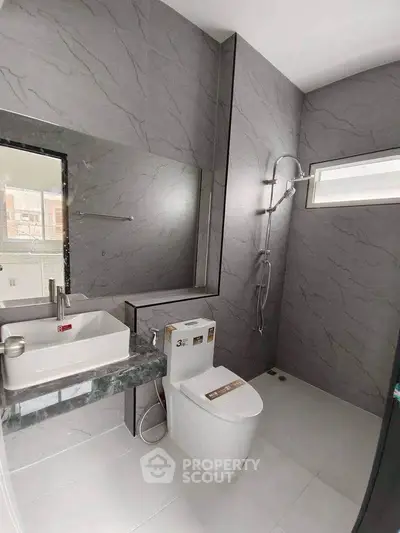 Modern bathroom with sleek design and marble accents