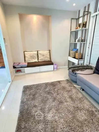 Cozy living room with modern decor and plush carpet