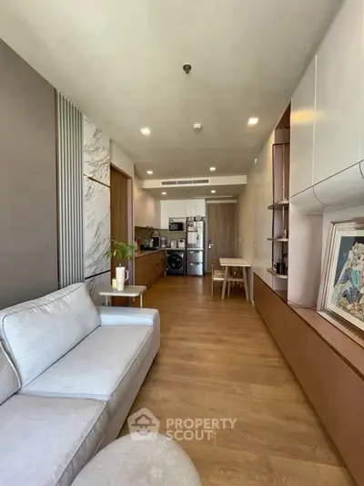 Modern living room with open kitchen and stylish decor